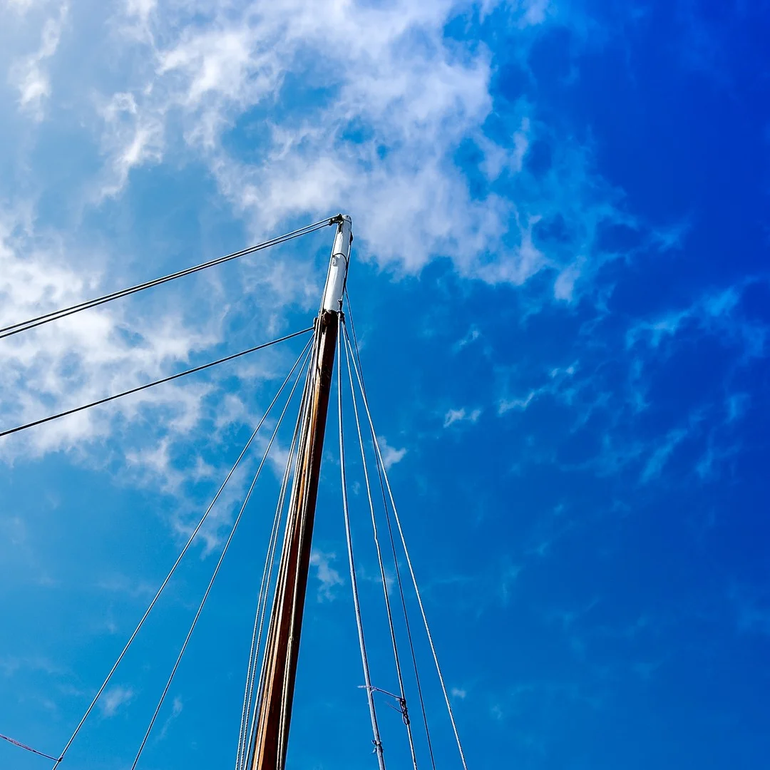 Photo 1 from Benjamin Simier’s Instagram post: Boat mast in a blue sky in France 🇫🇷⛵