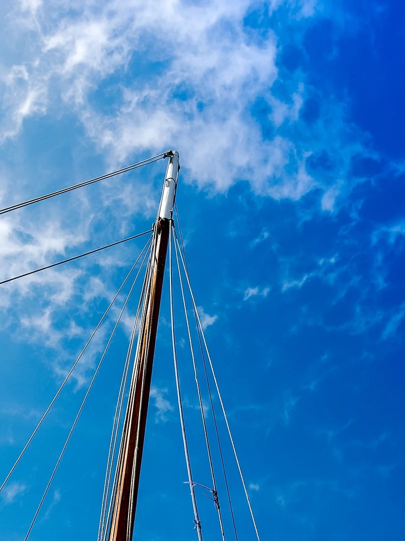 Photo 1 from Benjamin Simier’s Instagram post: Boat mast in a blue sky in France 🇫🇷⛵