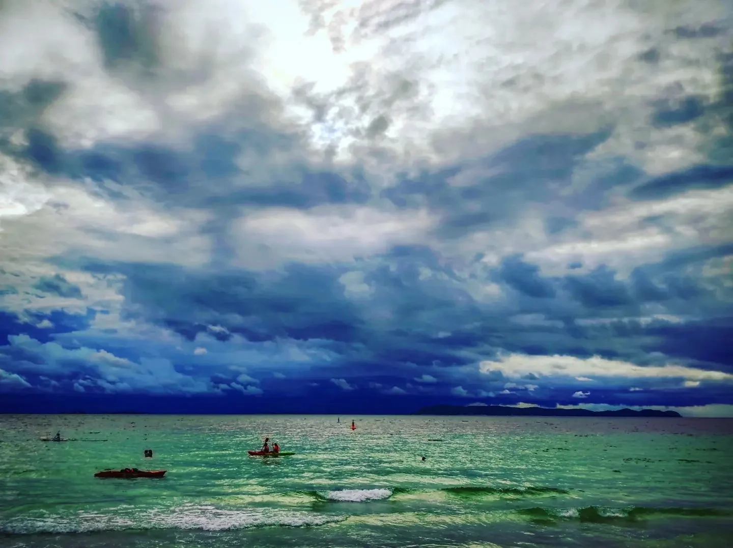 Photo 1 from Benjamin Simier’s Instagram post: Everyone on the beach saw the sky like this but nobody though: "maybe need to move before raining"... 15min after this photo 🌧️🌧️🌧️