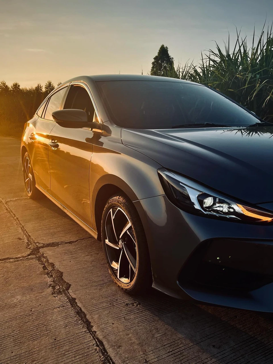 Photo 1 from Benjamin Simier’s Instagram post: A breathtaking sunset paints my stunning MG5 in golden hues - a perfect Buriram moment ✨
