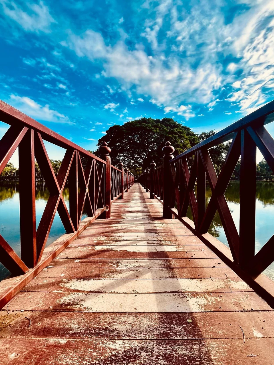 Photo 1 from Benjamin Simier’s Instagram post: The rhythm of the river, the scent of wood, and the whispers of the wind - this unassuming bridge in Sukothai is a symphony for the senses. 🇹🇭