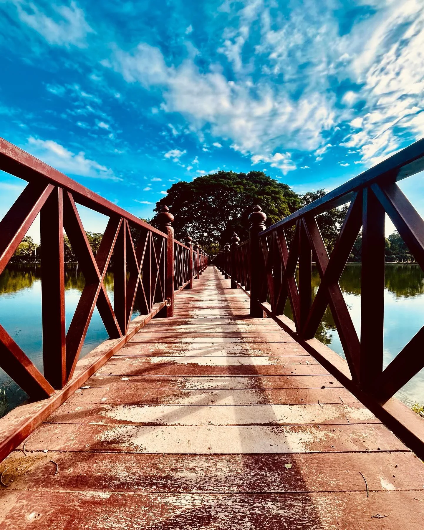 Photo 1 from Benjamin Simier’s Instagram post: The rhythm of the river, the scent of wood, and the whispers of the wind - this unassuming bridge in Sukothai is a symphony for the senses. 🇹🇭