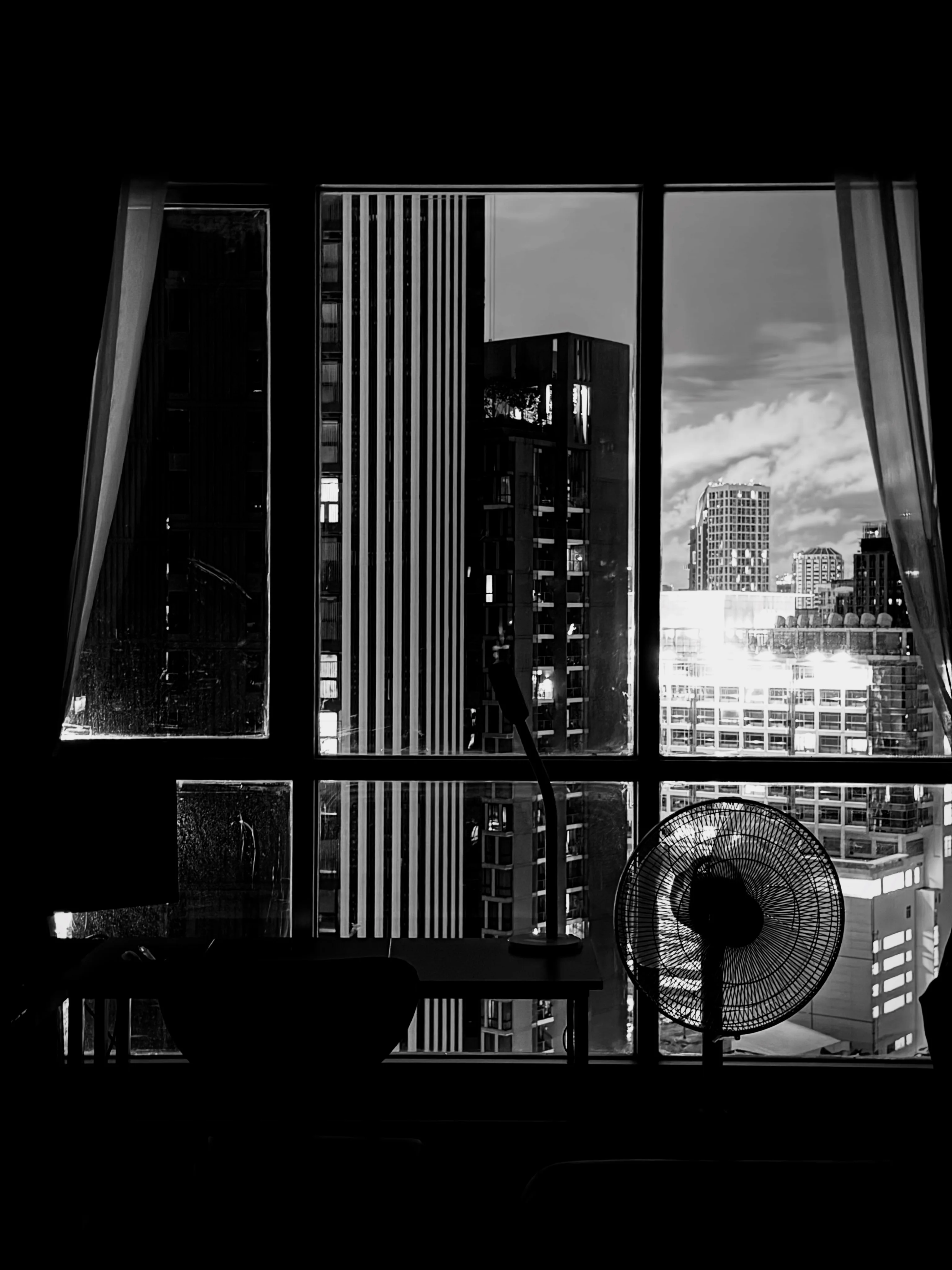 Photo 1 from Benjamin Simier’s Instagram post: Shadows inside, skyscrapers outside. Quiet moments in the middle of the city