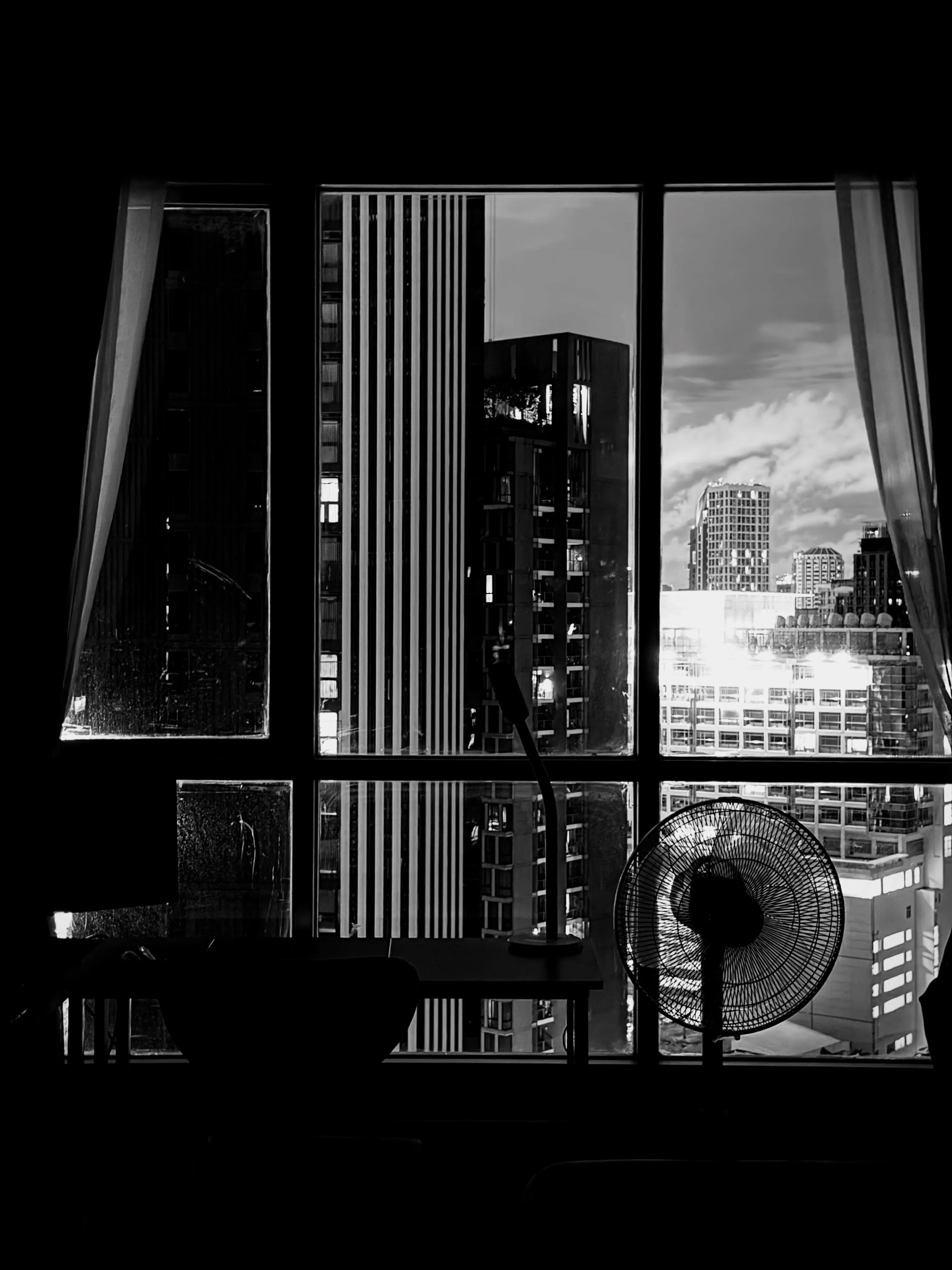 Photo 1 from Benjamin Simier’s Instagram post: Shadows inside, skyscrapers outside. Quiet moments in the middle of the city
