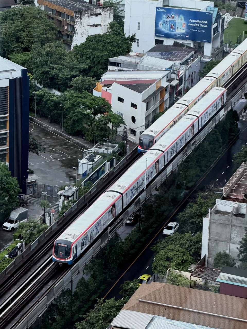 Photo 1 from Benjamin Simier’s Instagram post: Riding the BTS above the urban rhythm of Bangkok 🚊