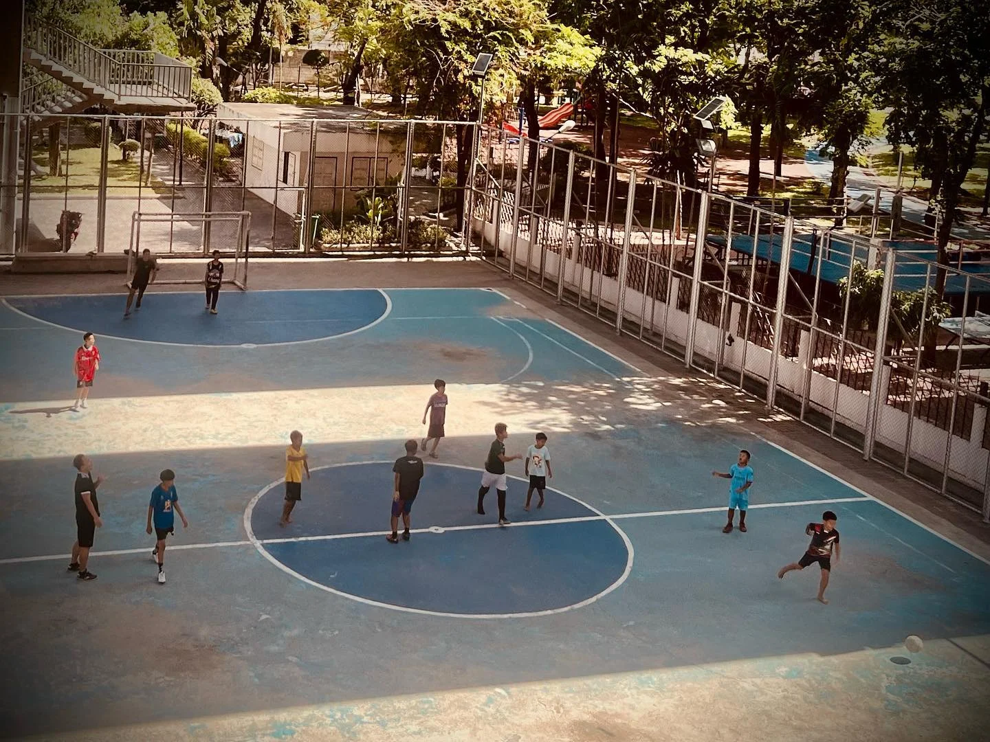 Photo 1 from Benjamin Simier’s Instagram post: Children play football at Bangkok