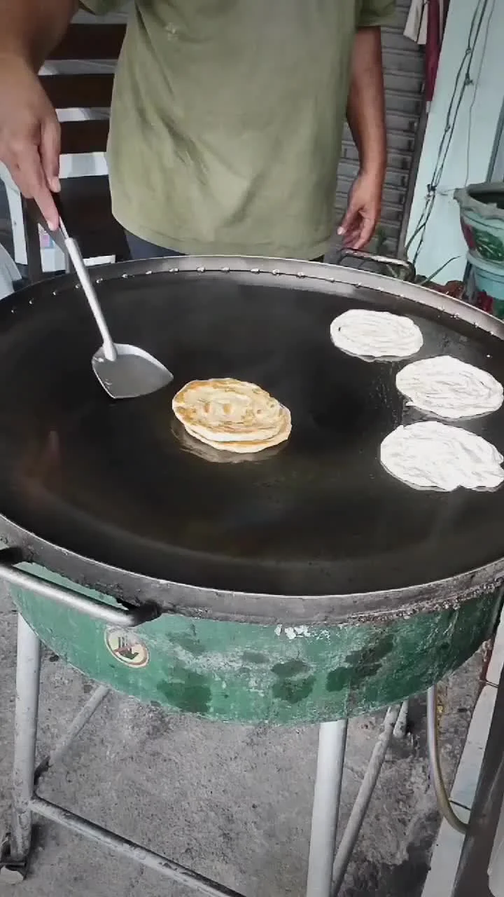 Video cover from Benjamin Simier’s Instagram reel: Cooking Roti in Thailand 🇹🇭