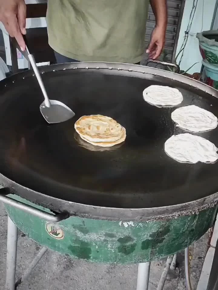 Video cover from Benjamin Simier’s Instagram reel: Cooking Roti in Thailand 🇹🇭